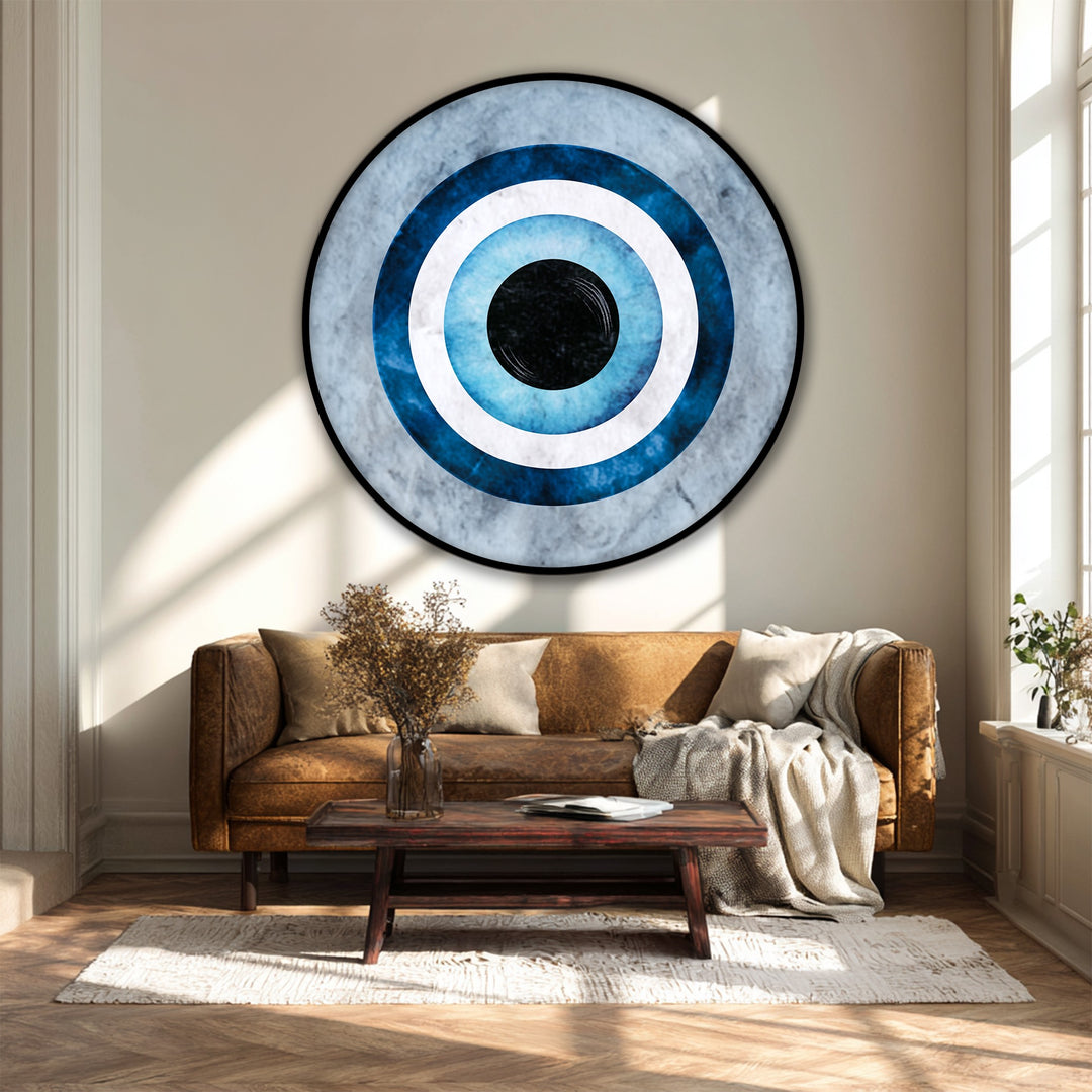 Deep layers of blue and white give dimension to this round canvas print, offering a captivating depth to this piece of framed canvas featuring a minimal evil eye symbol.