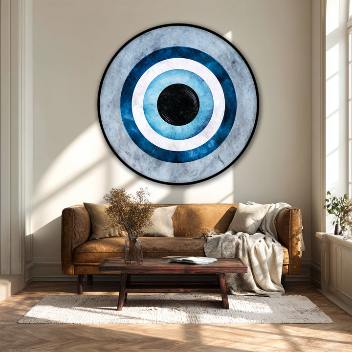 Deep layers of blue and white give dimension to this round canvas print, offering a captivating depth to this piece of framed canvas featuring a minimal evil eye symbol.