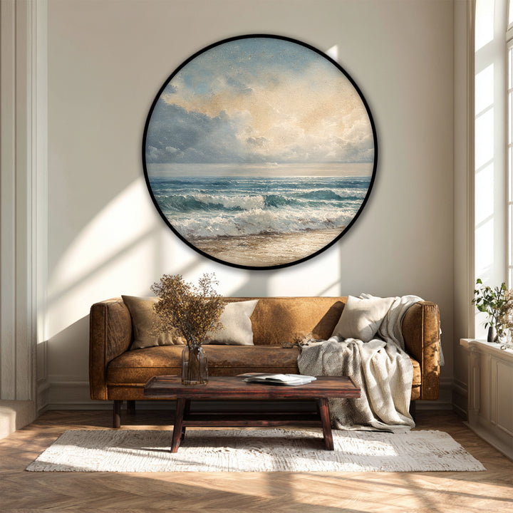 Highlighting the abstract quality, the circular canvas wall art features blurred strokes of blue and beige in an impressionistic seascape as a calming canvas wall art.