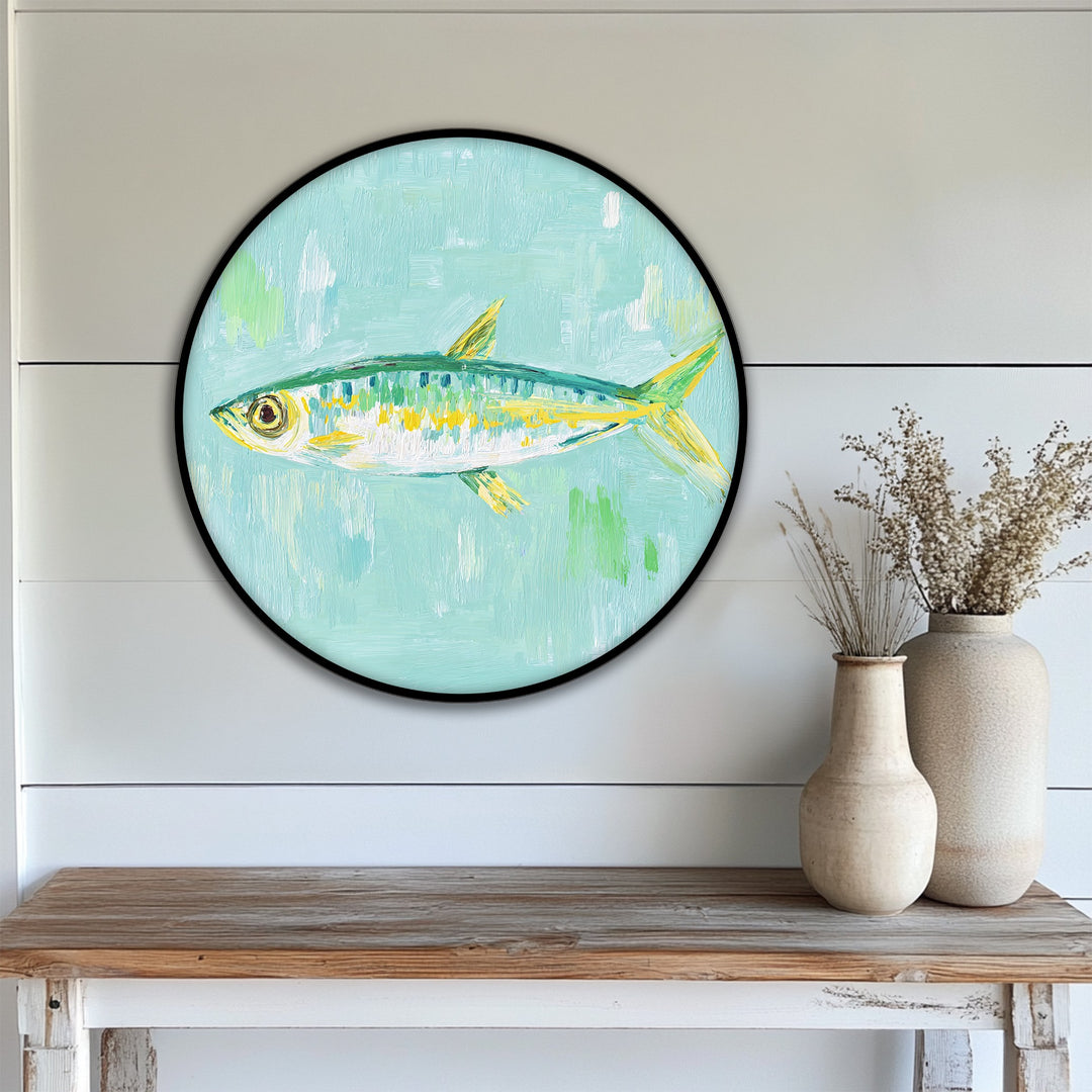 Subtle light accentuates the shadow behind this pastel fish painting on a round canvas, enhancing the allure of these big canvas prints with coastal minimalist wall art.