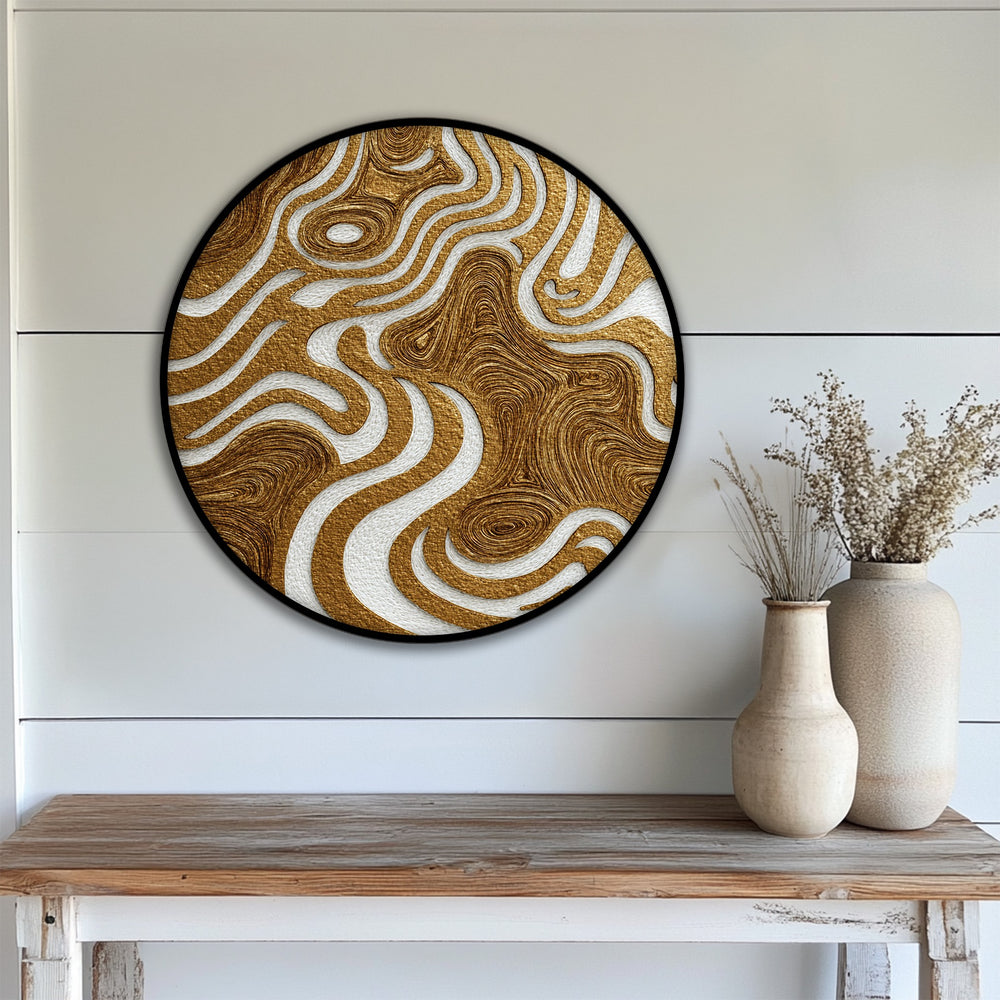 The golden organic flow round canvas print beautifully showcases the transition between shimmering gold and crisp white, enhanced by the elegance of the framed canvas.