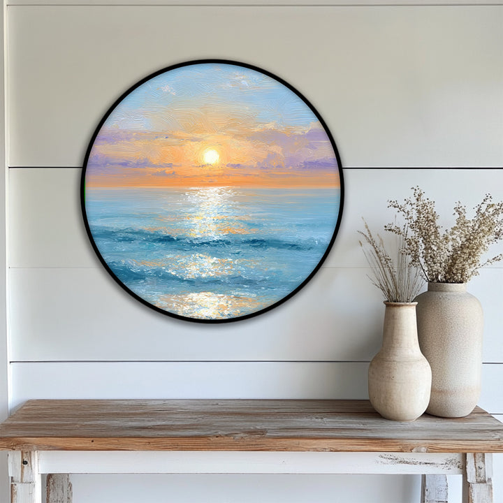 Realistic detail captures the hanging canvas of a golden sunrise over a calm ocean in this serene, round coastal wall art print.