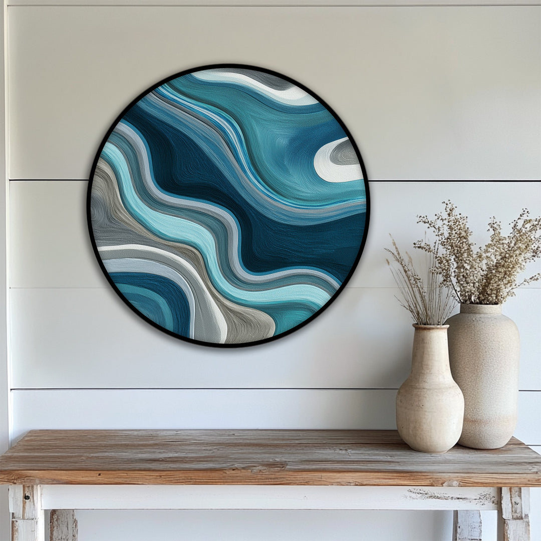 The realistic detail brings to life this fluid teal waves round canvas print, a unique canvas print showcasing the graceful blend of blues and grays in an abstract design.