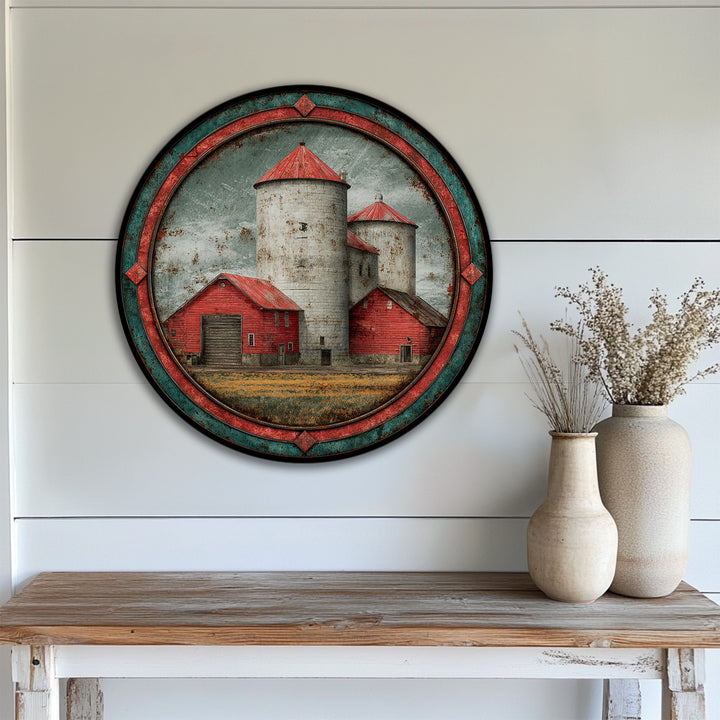 Visual rhythm is created by the silos and barns in this rustic red barn and silos landscape round canvas artwork, providing a sense of pattern and flow.