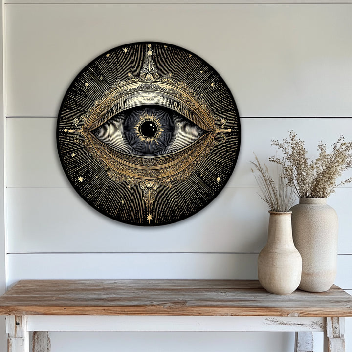 Black is the dominant color in this round canvas wall decor print featuring a golden mystic eye and celestial design for vintage-inspired art.