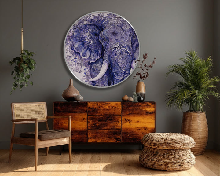 Subtle light and shadow play on the intricate details of this round blue elephant canvas wall decor, highlighting its texture and depth.