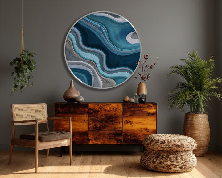Layering hues create a fluid teal waves design in this framed canvas round print, a modern abstract wall art piece with depth and visual movement.