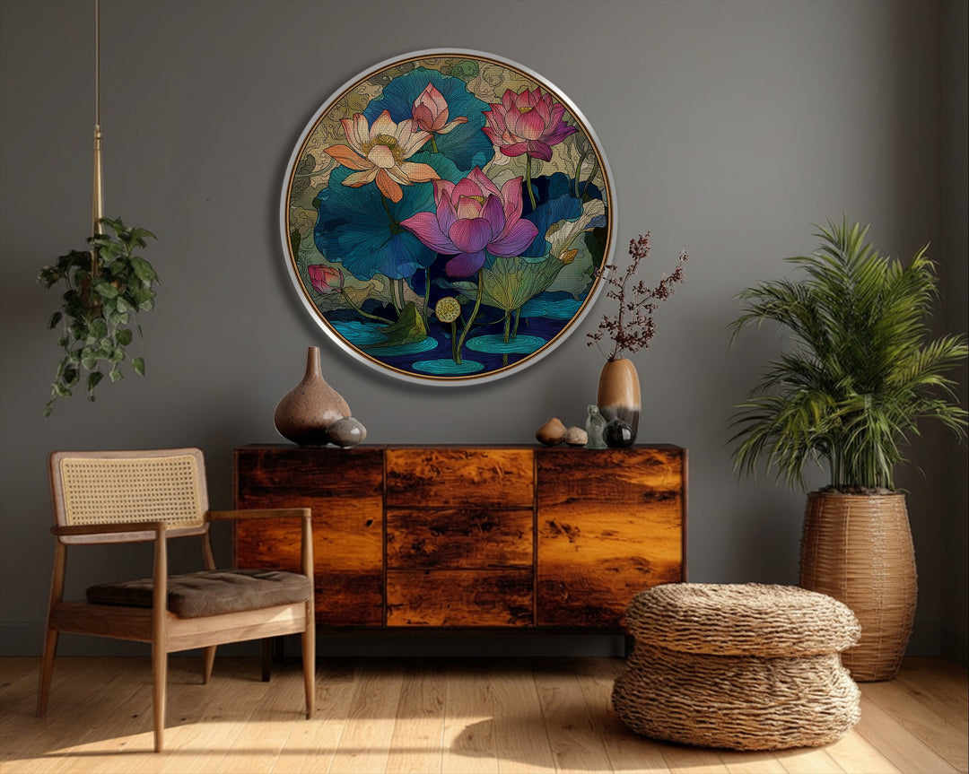 The stillness of ornamental lotus flowers radiates from this round decorative floral wall art, showcased as a hanging canvas in a serene, elegant setting.