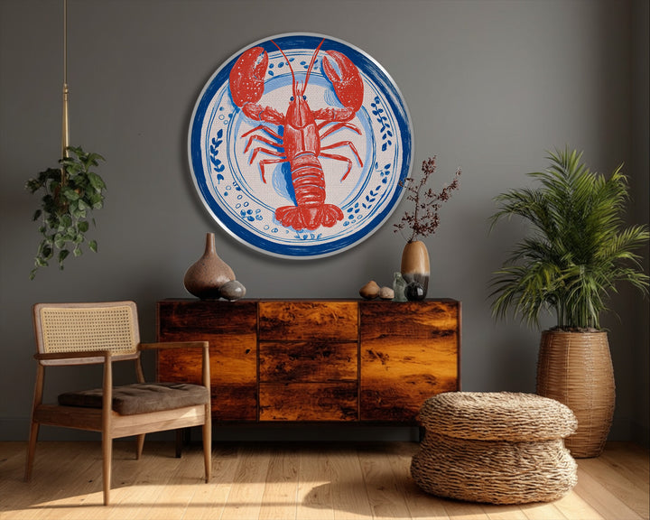 Negative space surrounds the printed red lobster and blue plate design, emphasizing the crispness of this coastal kitchen canvas pictures wall art.