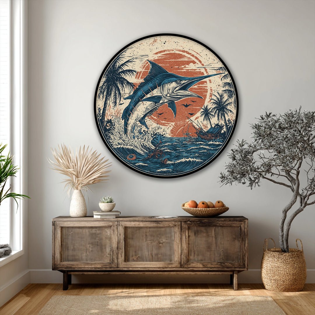 Featuring high quality canvas prints, the round wall art showcases a marlin, ocean waves, sun, and palm trees, set within a perfect circle, softened by organic shapes.