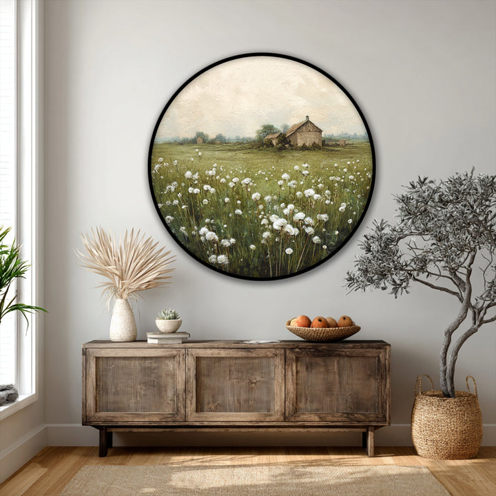 Dominated by verdant green, this round canvas art features a rustic barn and a countryside meadow to deliver a charming canvas art landscape piece.