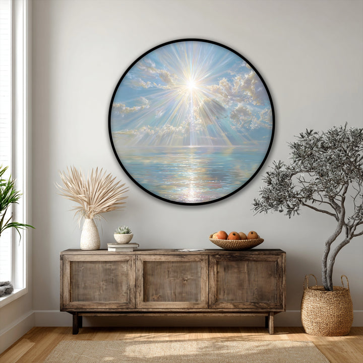 Subtle negative space around this round canvas print highlights the radiant sun rays over a calm sea, enriching the canvas wall decor with visual depth.