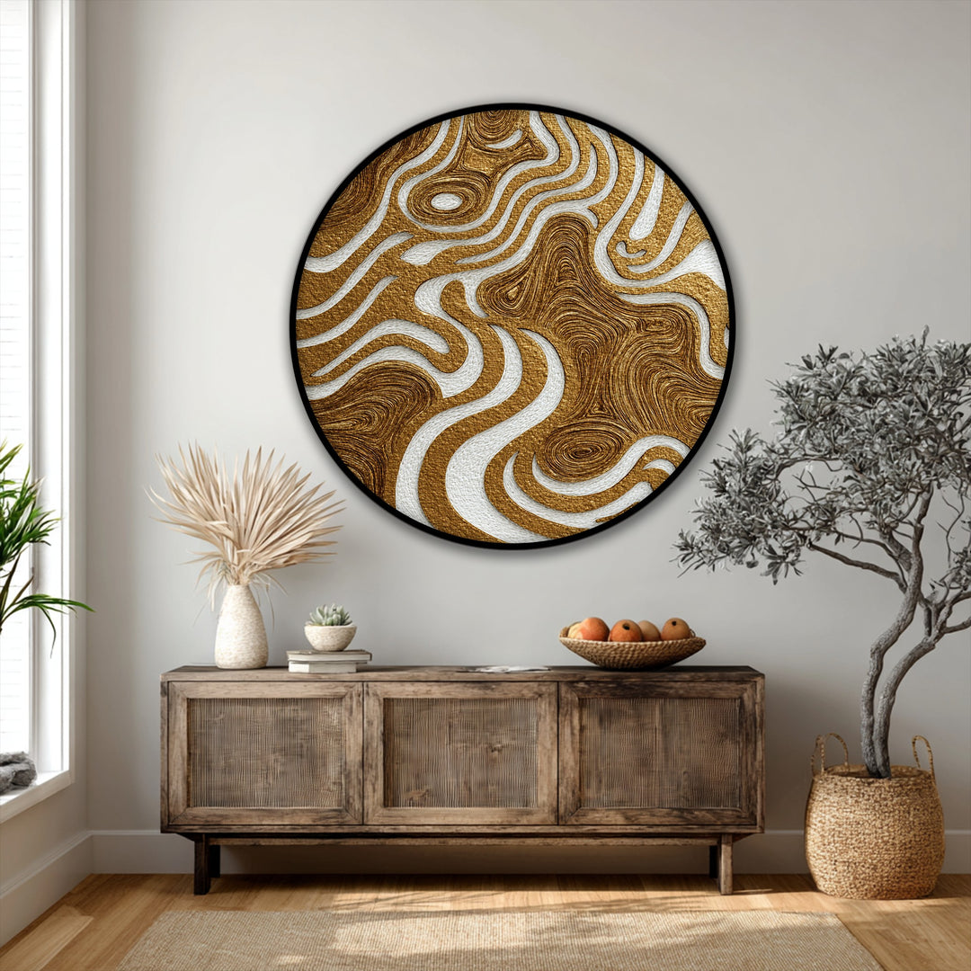 Illuminated by the brightest area, this round canvas print displays flowing gold and white abstract patterns as premium canvas decor for a modern, textured wall art piece.