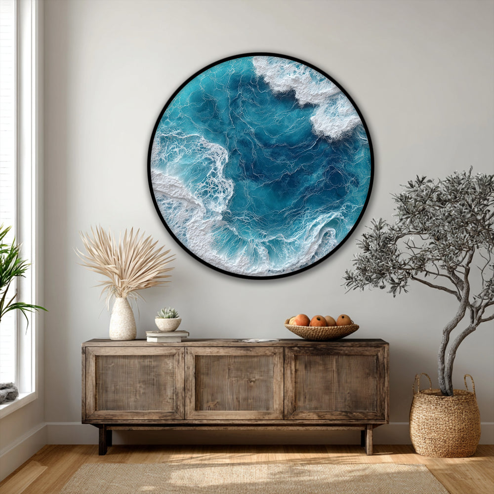 Windswept surf swirls in organic forms, visualized as a turquoise sea in this ocean wave aerial round canvas wall art.