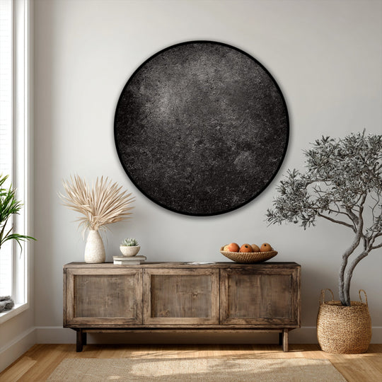 Dominating the eye, a dark textured round canvas print becomes a striking piece of canvas wall decor and the loudest element in this modern wall art display.