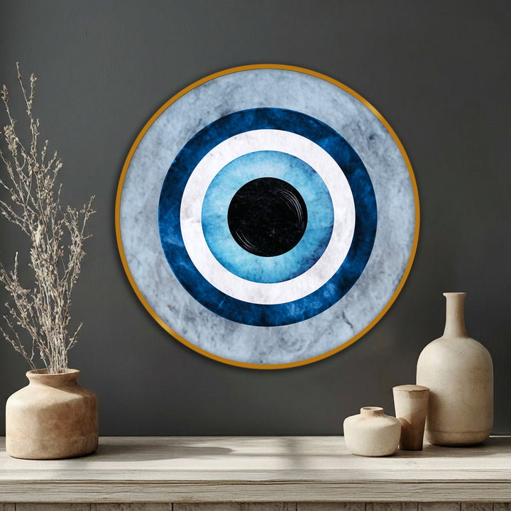 The realistic detail showcases this round canvas painting of a striking blue evil eye symbol with incredible depth and clarity, creating a captivating piece of minimal wall art.