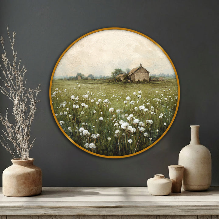 Gentle gusts seem to animate the meadow in this round canvas painting, where white wildflowers sway around the rustic barn in a dance of nature.