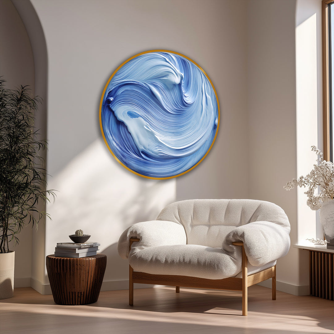 Shadowing the lower-left corner, the ocean flow blue abstract round canvas art prints accentuates a modern wave wall art piece in a sun-drenched room.