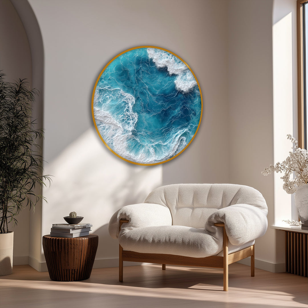 Calm, inviting mood conveyed by the ocean wave aerial round hanging canvas print, featuring turquoise sea wall art, as it complements the room's serene atmosphere.