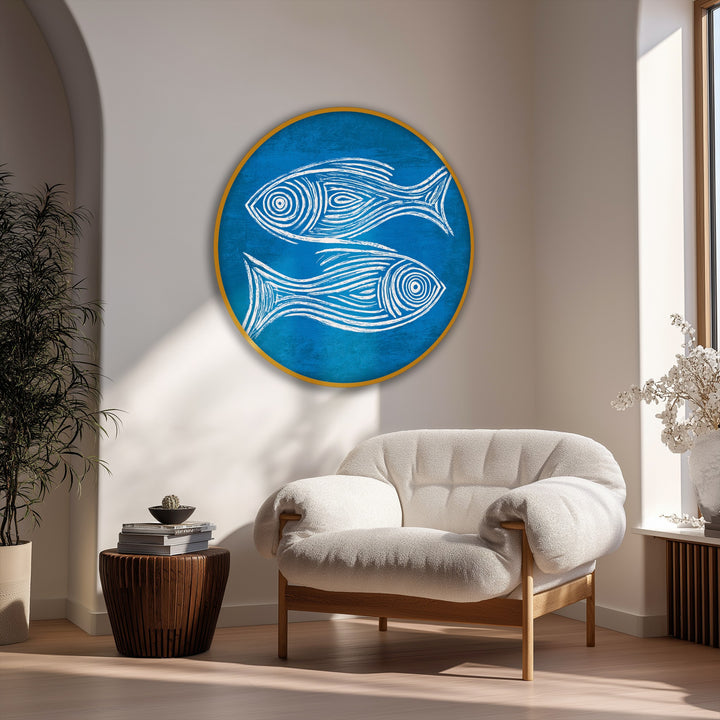 Surface texture highlights the textured canvas artwork of this minimal blue fish sketch round canvas print, adding dimension to the coastal wall art.