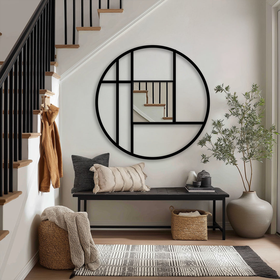Featuring neutral-toned walls and a staircase, the background complements the unique metal wall art geometric circle mirror frame with its minimalist and modern home decor design.
