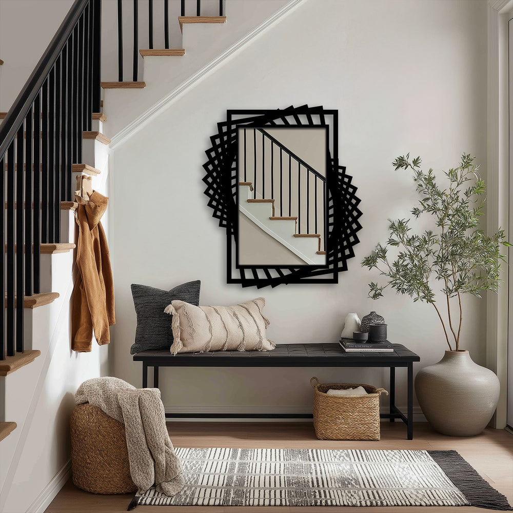 Low color saturation highlights the modern black dynamic twist frame of this metal floor mirror, a striking example of decorative metal art in an entryway.