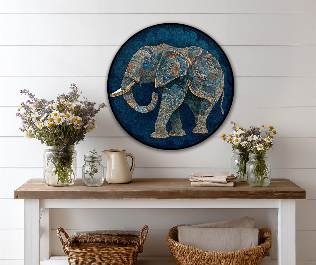Azure elephant is the central subject in this round oil painting wall art, showcasing a decorative elephant silhouette with intricate patterns and gold accents.
