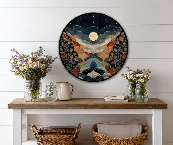 Loudest is a round celestial valley scene featuring a moonlit landscape in oil painting home decor with stylized hills, painted flowers, and a navy starry sky.