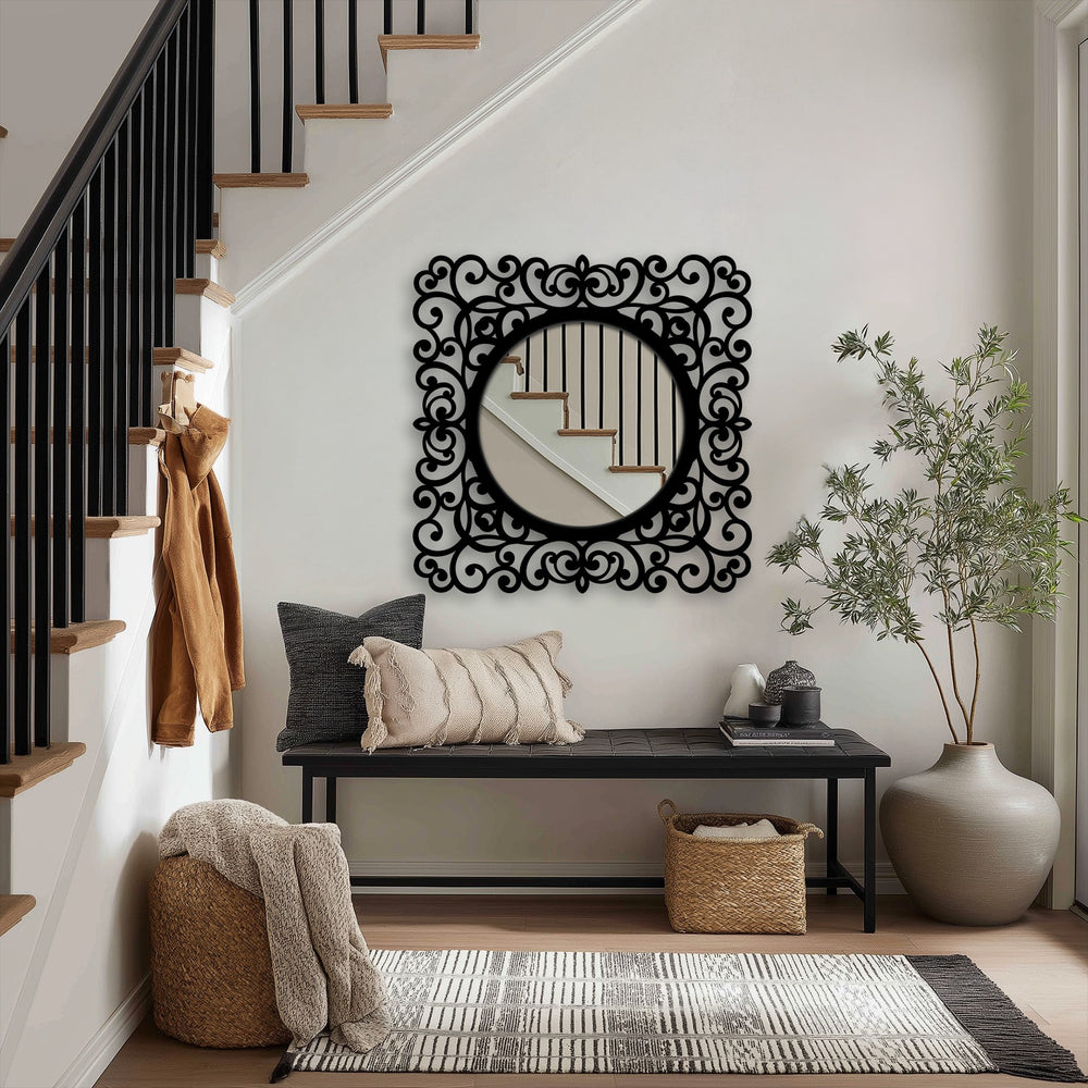 The focal point of the baroque scroll frame round black metal floor mirror showcases exquisite metal artwork, enhancing the entryway decor with its ornate design.