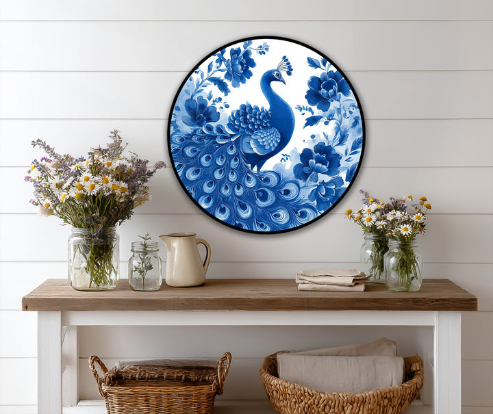 The focal point captures the exquisite details of the Indigo Peacock Among Blossoms round oil painting, showcasing vibrant oil painting art prints with its elegant floral design.