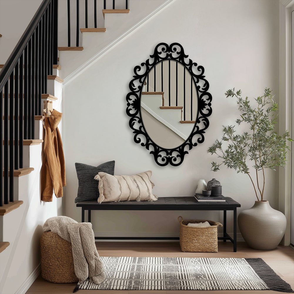 Reflecting stairs and light, the ornate scroll oval floor mirror enhances the entryway with decorative detail, a perfect example of decorating with wall mirrors.