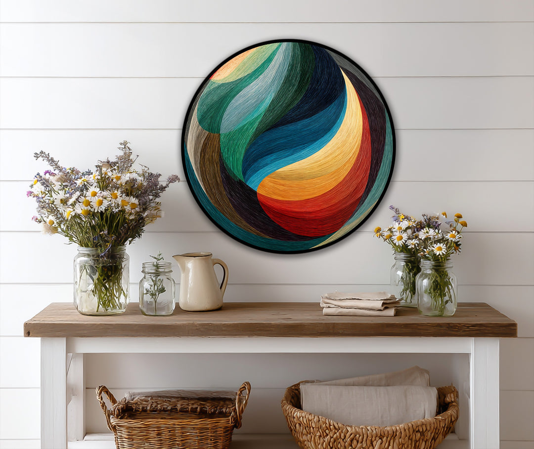 The abstract quality of this chromatic flow oil painting art piece presents a vibrant composition of flowing hues shaped in a mesmerizing round form.