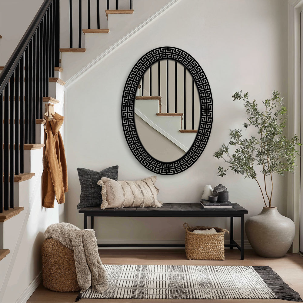 Showcasing the layering effect, the Neo Greco patterned oval floor mirror reflects the staircase, creating depth with a unique metal wall art frame for a modern aesthetic.