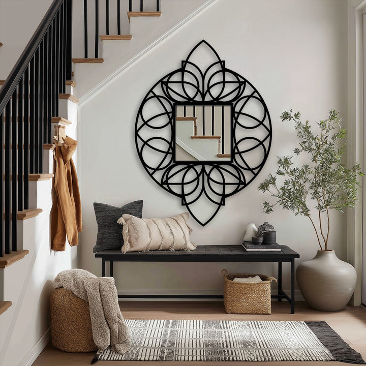 Swirling black metal artwork evokes a sense of motion in this geometric floral mandala floor mirror, adding a dynamic touch to its reflection as mirror for wall decor.