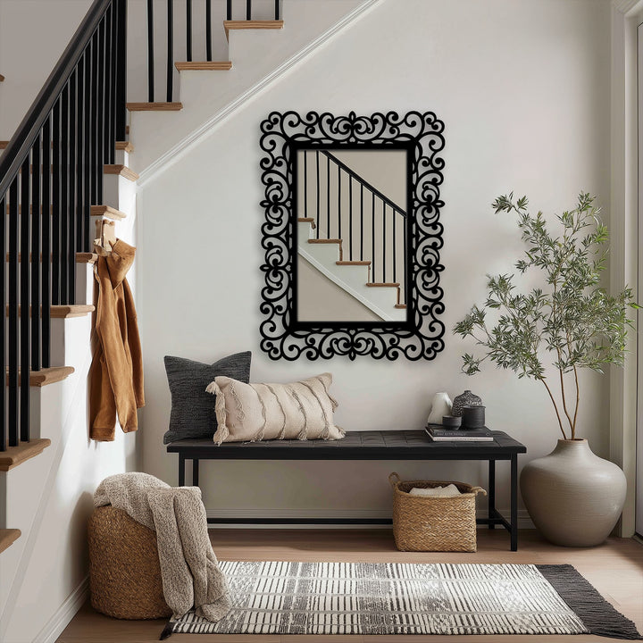 Rectangular decorative metal art features an ornate black baroque scroll frame, adding a unique and modern design element to the entryway.