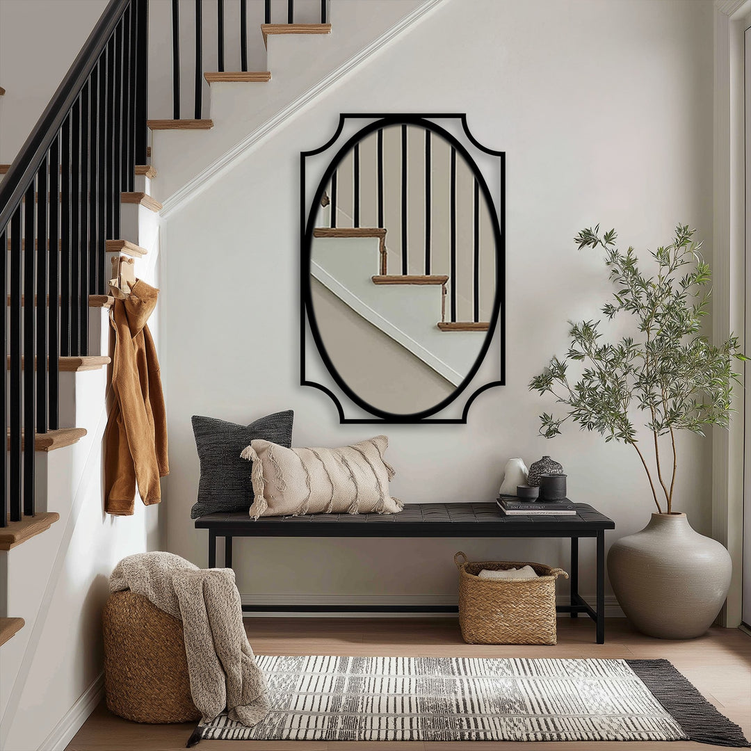 Vertically oriented, the oval mirror for wall decor has a distinctive curved frame, enhancing the hallway's minimalist aesthetic.