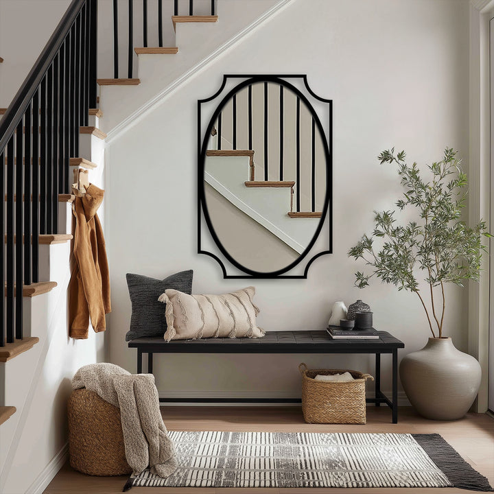 Vertically oriented, the oval mirror for wall decor has a distinctive curved frame, enhancing the hallway's minimalist aesthetic.