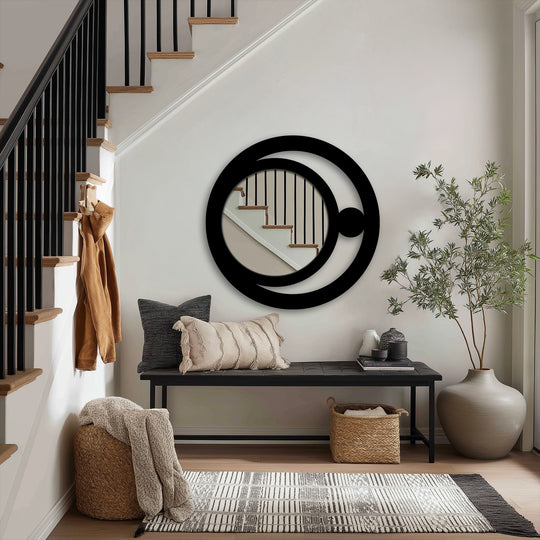 Negative space is cleverly used in this modern crescent orb metal art for wall decorative mirror, creating a minimalist celestial design focal point in an entryway.