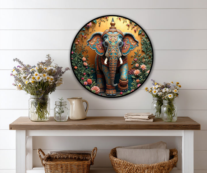 The intricate brushwork highlights the ornate details and golden tones of this vibrant Sacred Garden Majesty floral Ganesha round oil painting art piece.