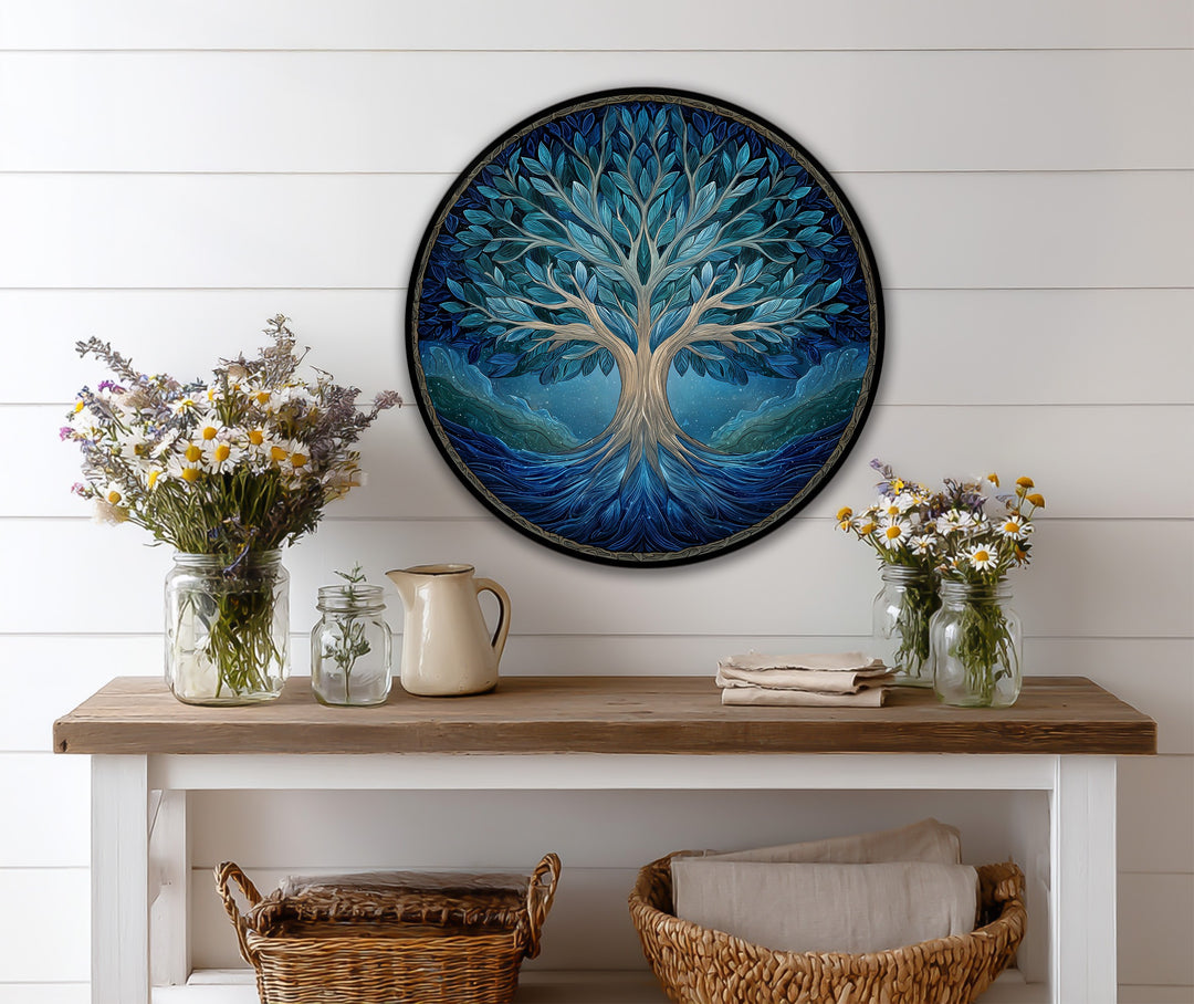 Wildflowers bursting from glass jars grace the foreground, accentuating the round wooden azure life tree oil painting art prints displayed above the console table.