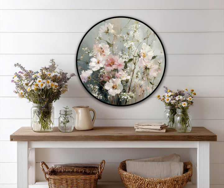 Swirling brushstrokes evoke an ethereal sense of movement in this round oil painting wall art, with its soft pastel wildflowers in full bloom, bringing a dynamic, floral energy.