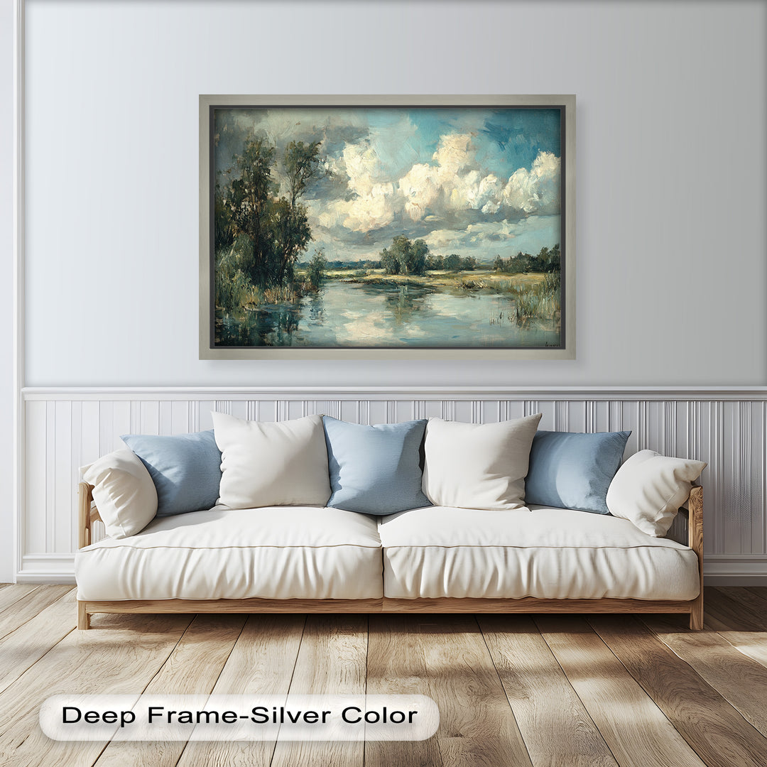 Tranquil riverside scene with billowing clouds and lush greenery.

