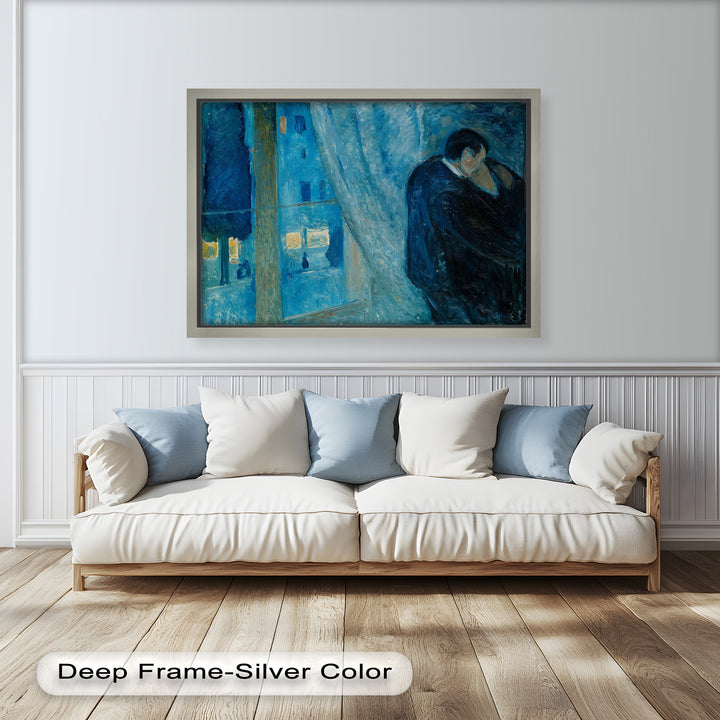 Moody blue interior scene of a couple embracing near a large window overlooking a softly lit street.

