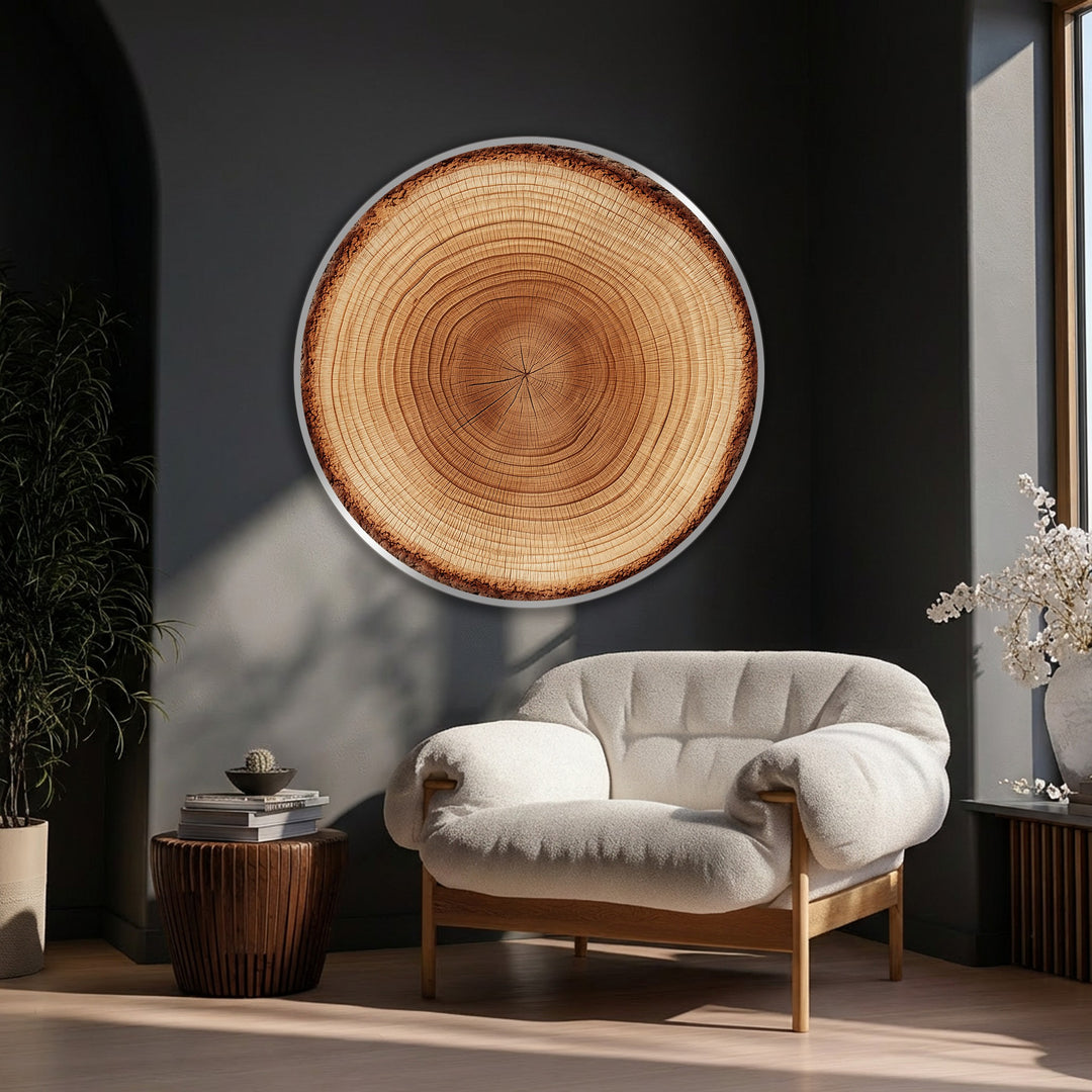 Softly tufted armchair complements the natural wood texture of the tree ring slice round canvas artwork, lending a cozy feel to the modern home decor.