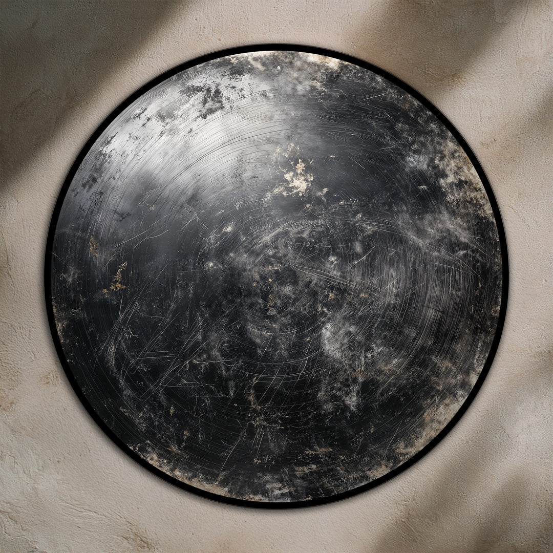 The minimal negative space surrounds a captivating, round wooden oil painting art piece, featuring an abstract midnight orbit design with dark metallic textures.