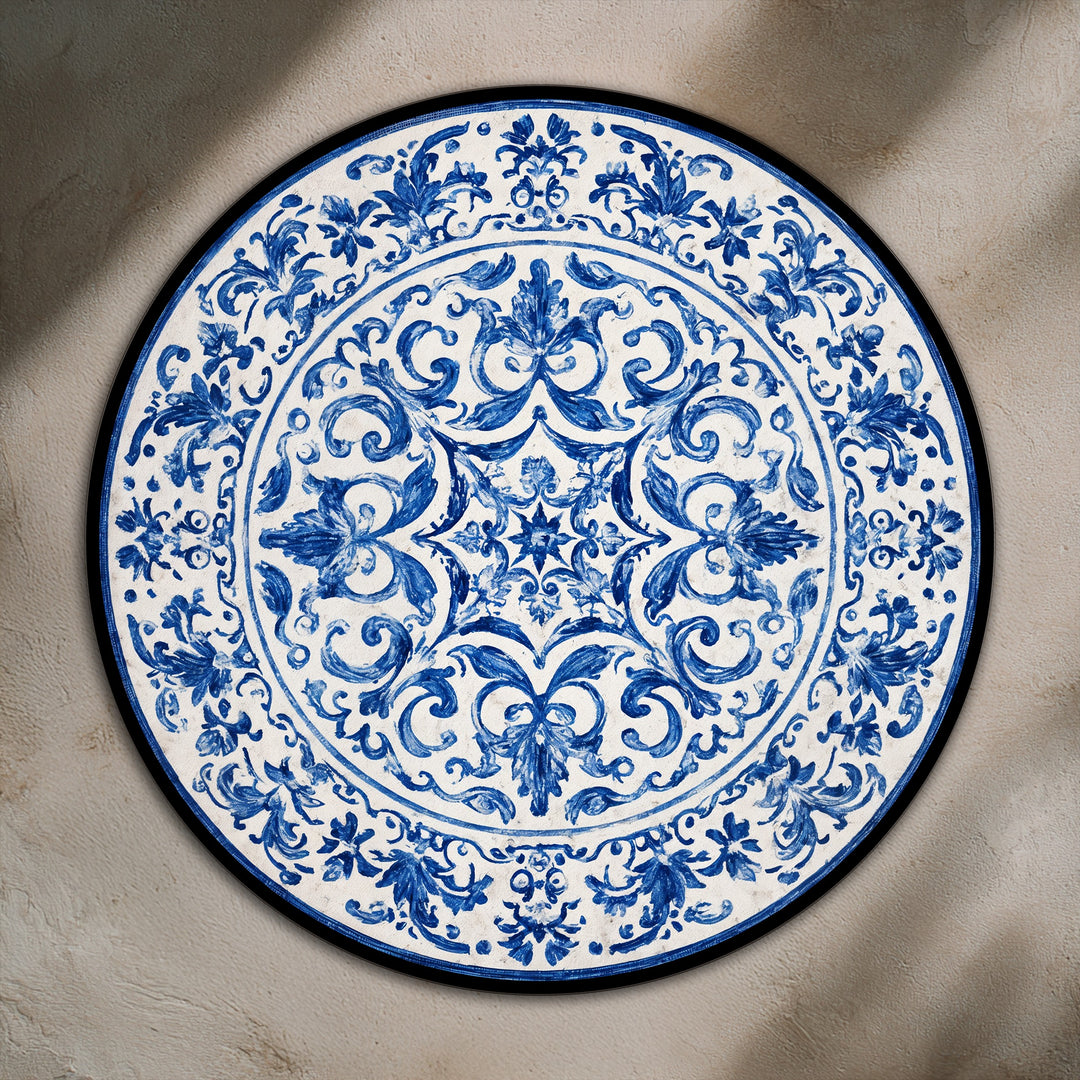 Softly painted ornamental leaves and scrolls define this classic blue pattern in a round oil painting home decor piece.