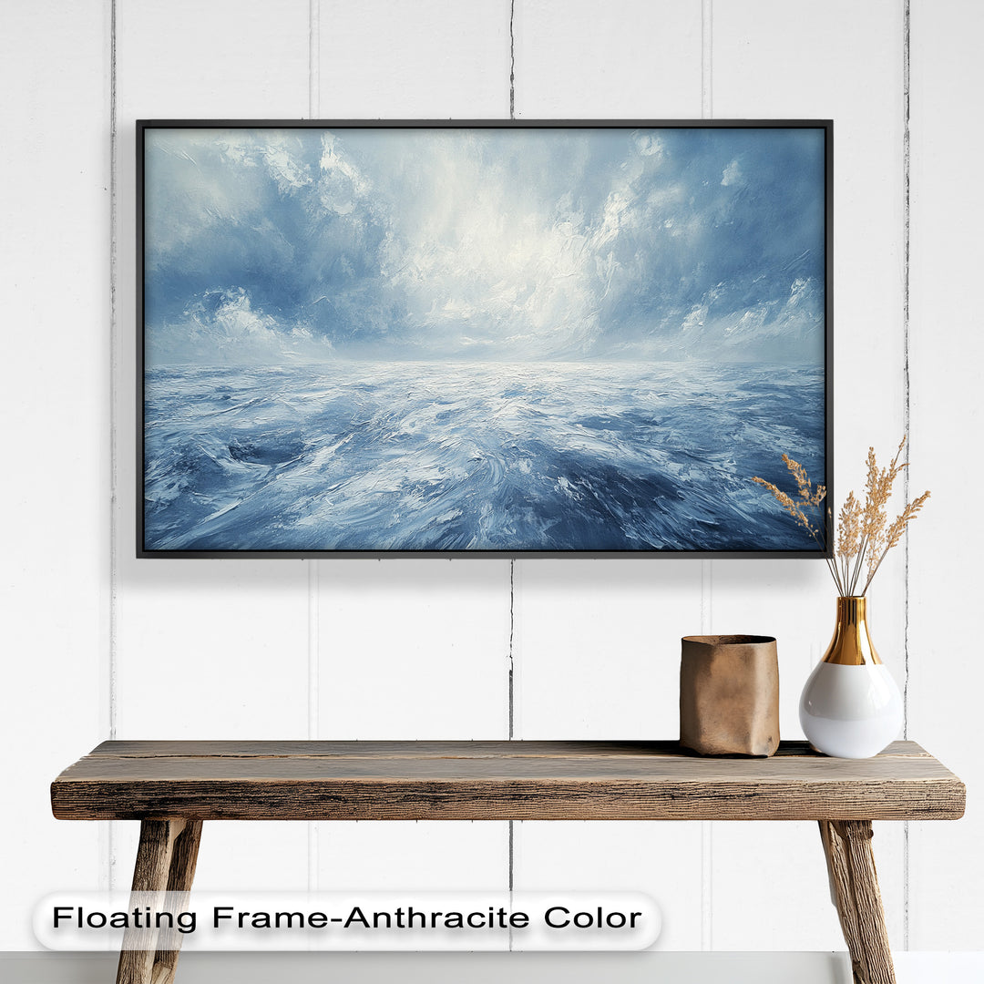 This captivating seascape painting showcases an endless ocean beneath a swirling, dramatic sky, using soft blues and whites to evoke calm and wonder.

