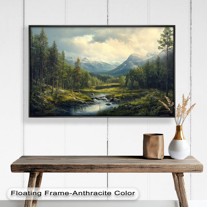 An idyllic nature setting where a clear brook winds through a forest clearing beneath the grandeur of distant mountains.