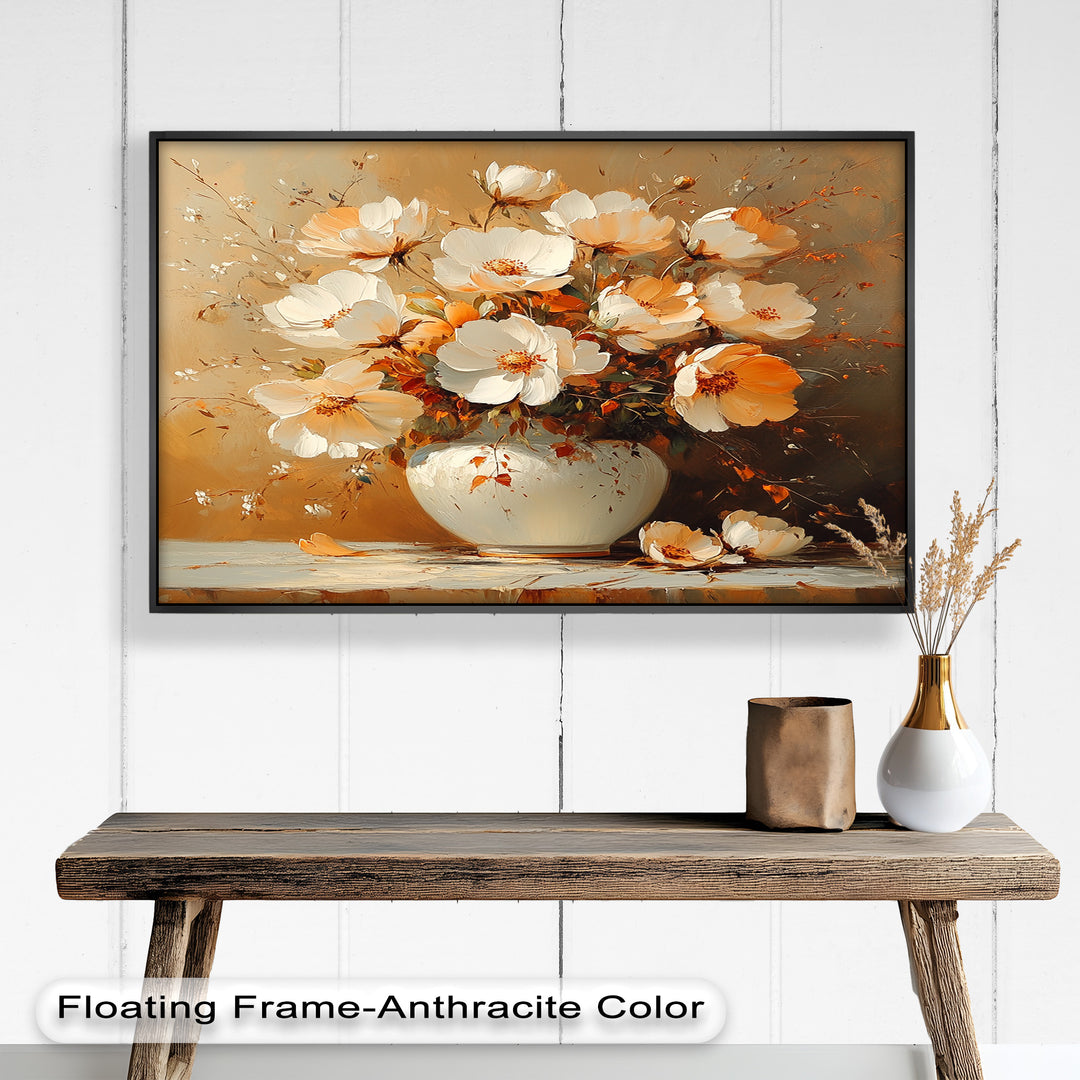 Golden-hued floral arrangement in a white ceramic vase.
