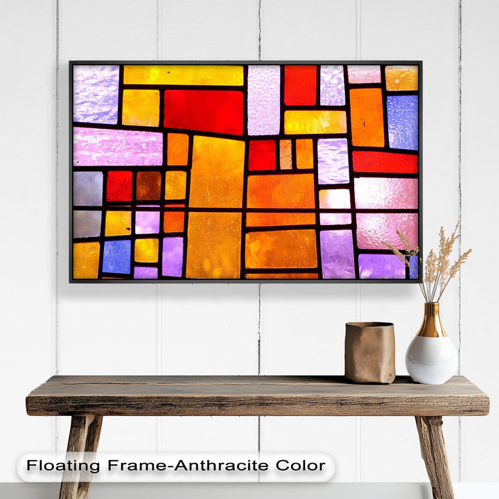 A luminous panel of multicolored translucent rectangles that blend warm and cool tones in a balanced, artistic pattern.